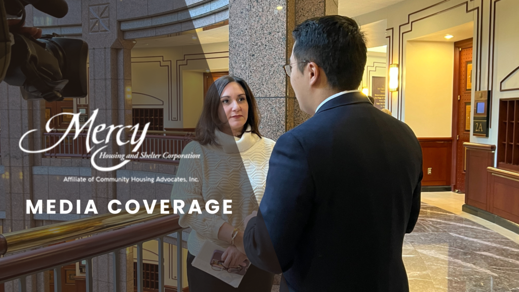 CEO Kara Capone speaking with a news reporter with a video camera off to the left hand side.