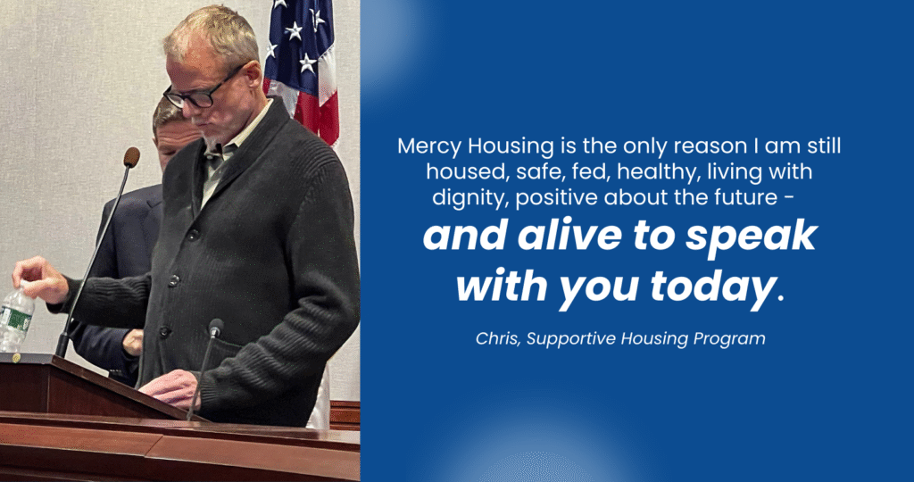 An older man speaking at a podium, saying "Mercy Housing is the only reason I am still housed, safe, fed, healthy, living with dignity, positive about the future - and alive to speak with you today."